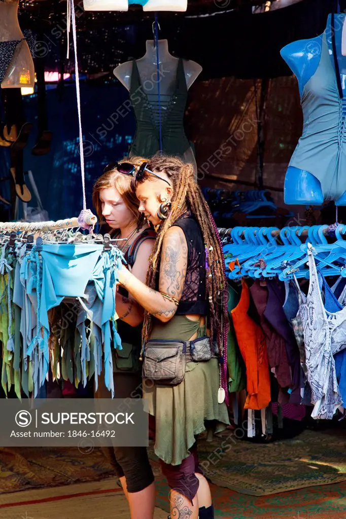 Tourists selecting clothes at a shop, Anjuna Beach Flea Market, Anjuna Beach, Anjuna, Bardez, North Goa, Goa, India