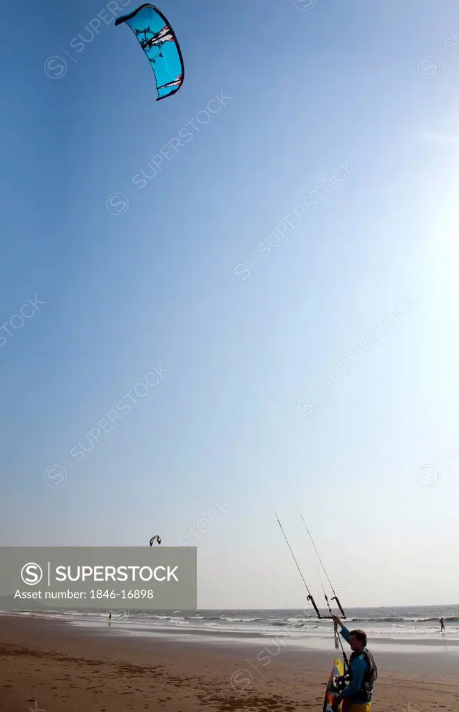 Person enjoying kiteboarding on the beach, Morjim, North Goa, Goa, India