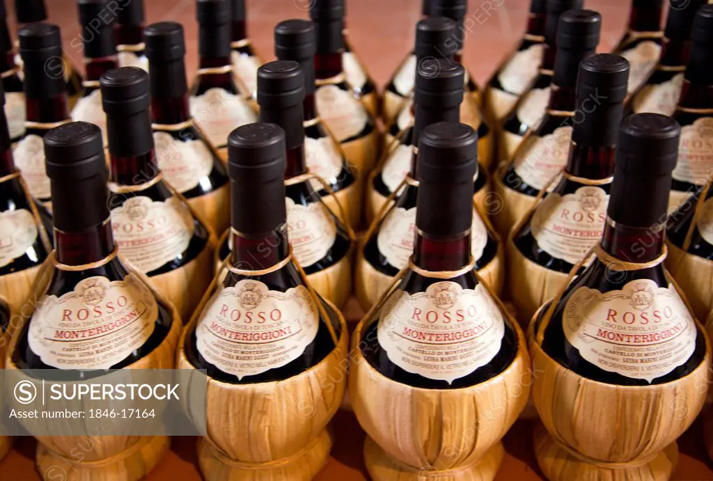 Wine bottles in cellar, Monteriggioni, Siena Province, Tuscany, Italy