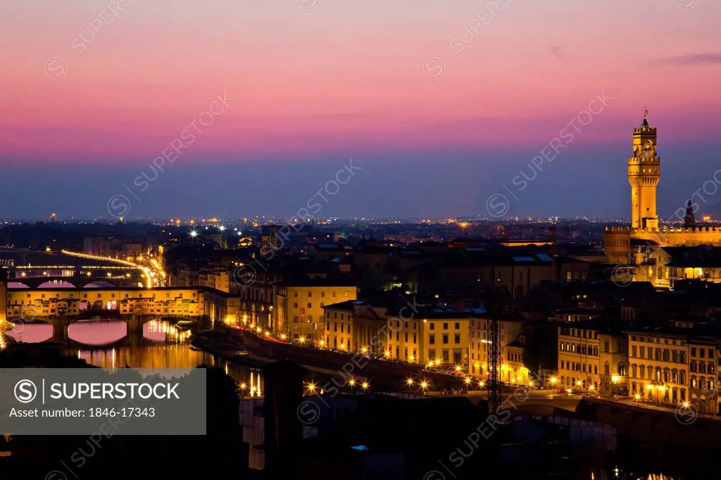 High angle view of city at dusk, Ponte Vecchio, Florence, Tuscany, Italy