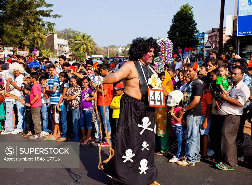 Performer entertaining crowd at procession in a carnival, Goa Carnivals, Goa, India