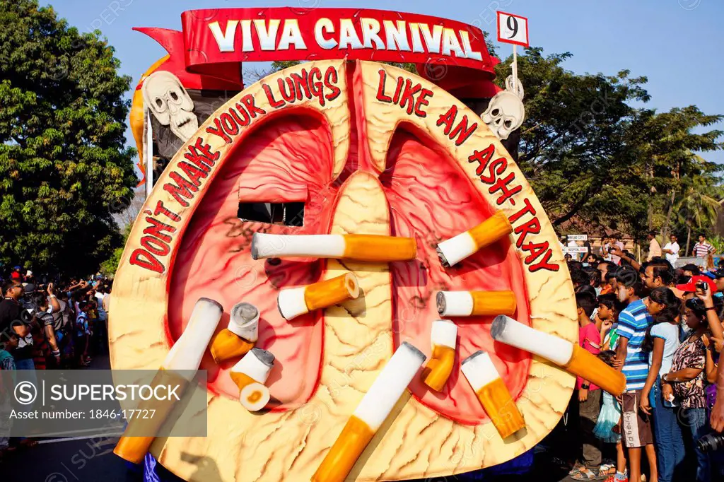 Glimpse representing cigarette addiction during procession in a carnival, Goa Carnivals, Goa, India