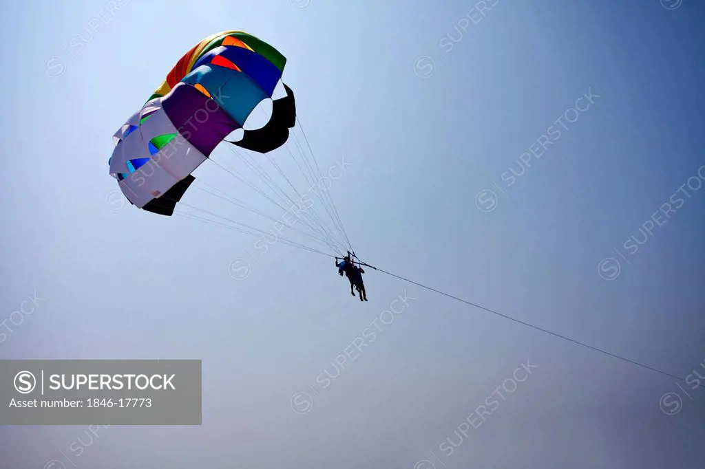 Tourists parasailing in the sky, North Goa, Goa, India