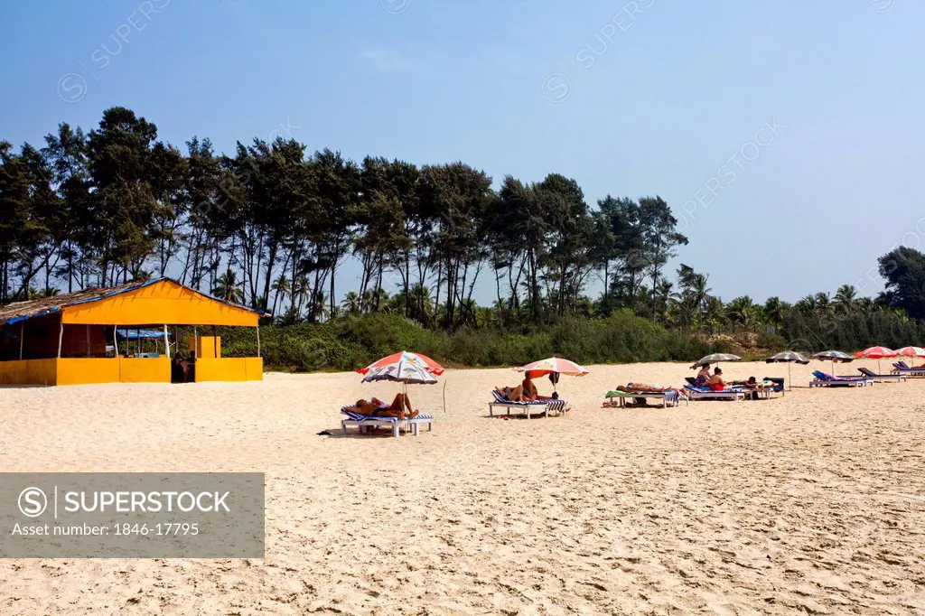 Tourists relaxing on the beach, Velssao Beach, Canacona, South Goa, Goa, India