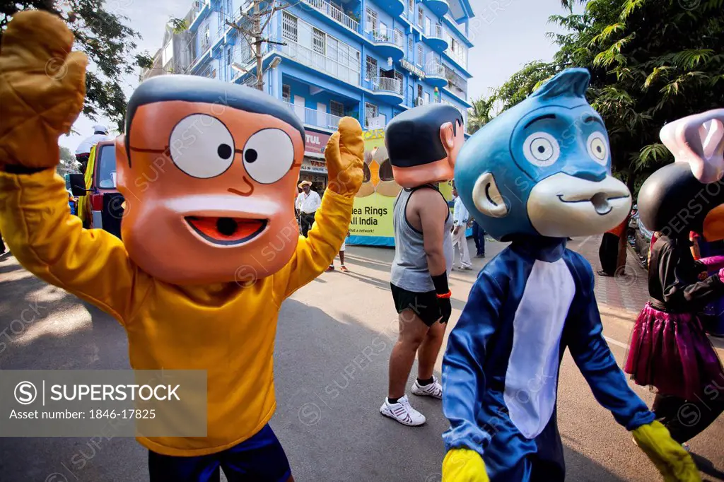 People in costume of cartoon characters during a procession in a carnival, Goa Carnivals, Goa, India