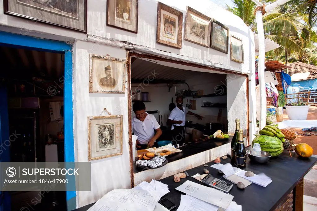 Chefs preparing food in a restaurant, Om Made Cafe, Anjuna, North Goa, Goa, India