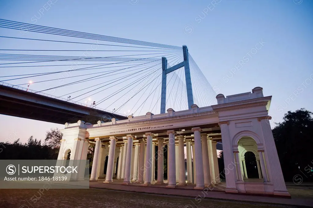 Facade of a memorial with bridge in the background, Prinsep Ghat, Kolkata, West Bengal, India