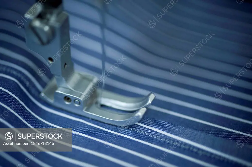 Cloth being stitched on the sewing machine