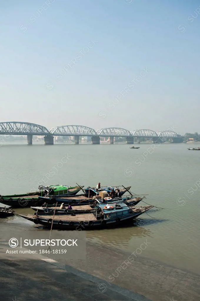 Boats in a River with bridge in the background, Vivekananda Setu, Hooghly River, Kolkata, West Bengal, India