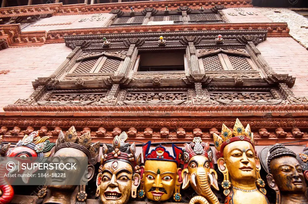 Typical masks based on religious designs for sale at a market stall, Swayambhunath, Kathmandu, Nepal