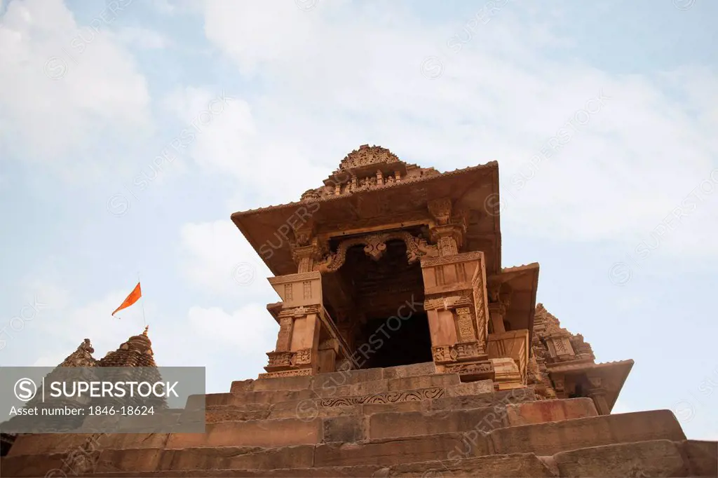 Low angle view of a temple, Khajuraho temples, Chhatarpur District, Madhya Pradesh, India