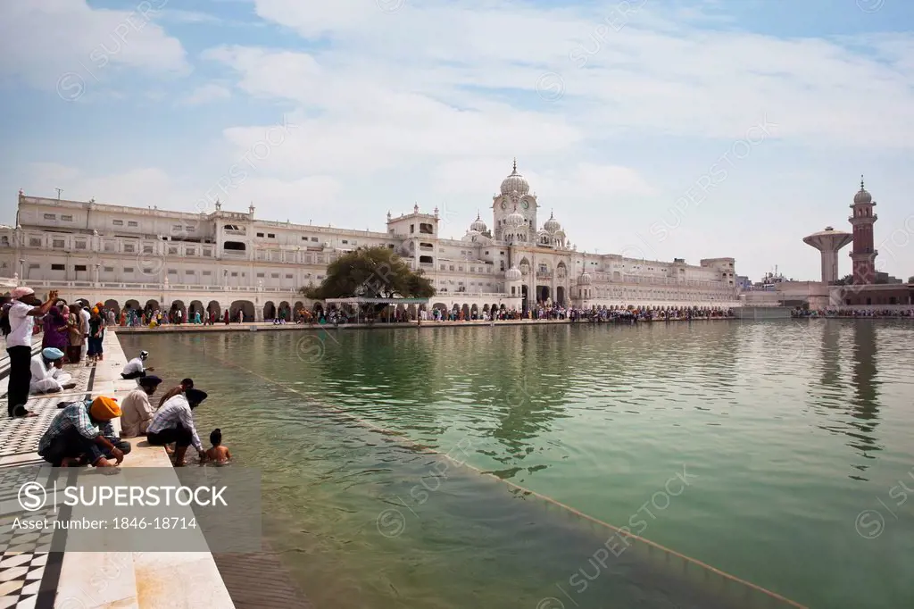 Sikh pilgrims at Nectar Pond in Golden Temple, Amritsar, Punjab, India