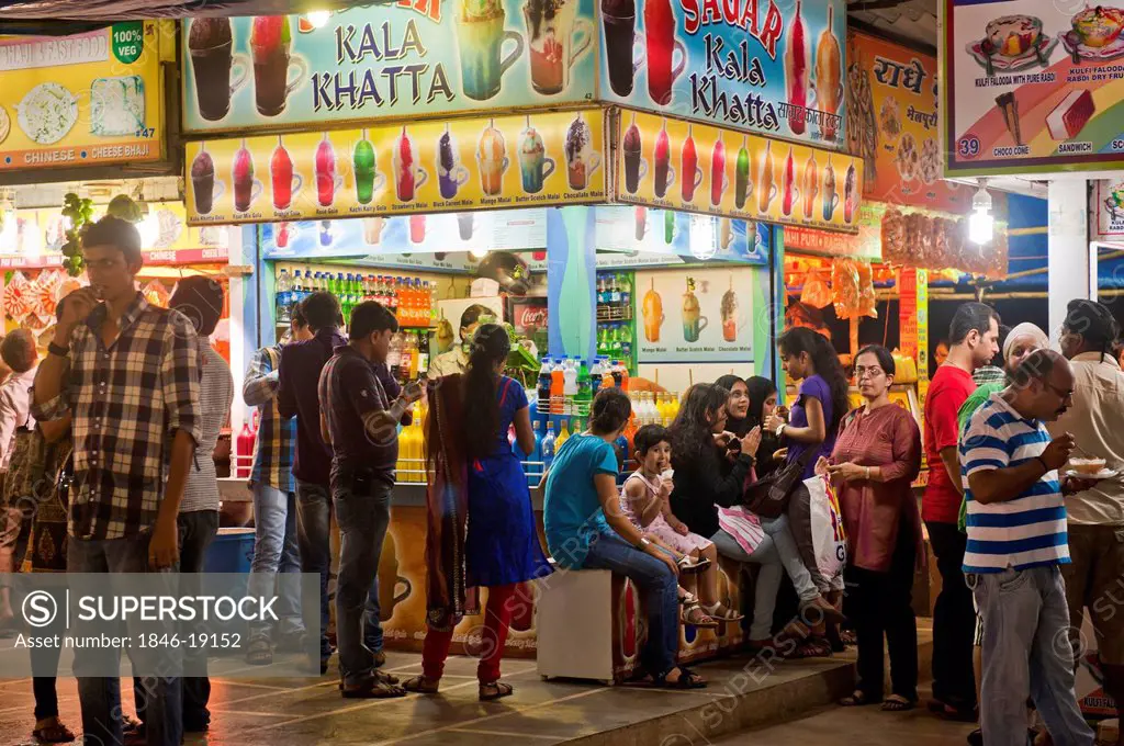 People eating ice cream at a ice cream parlor, Juhu Beach, Mumbai, Maharashtra, India