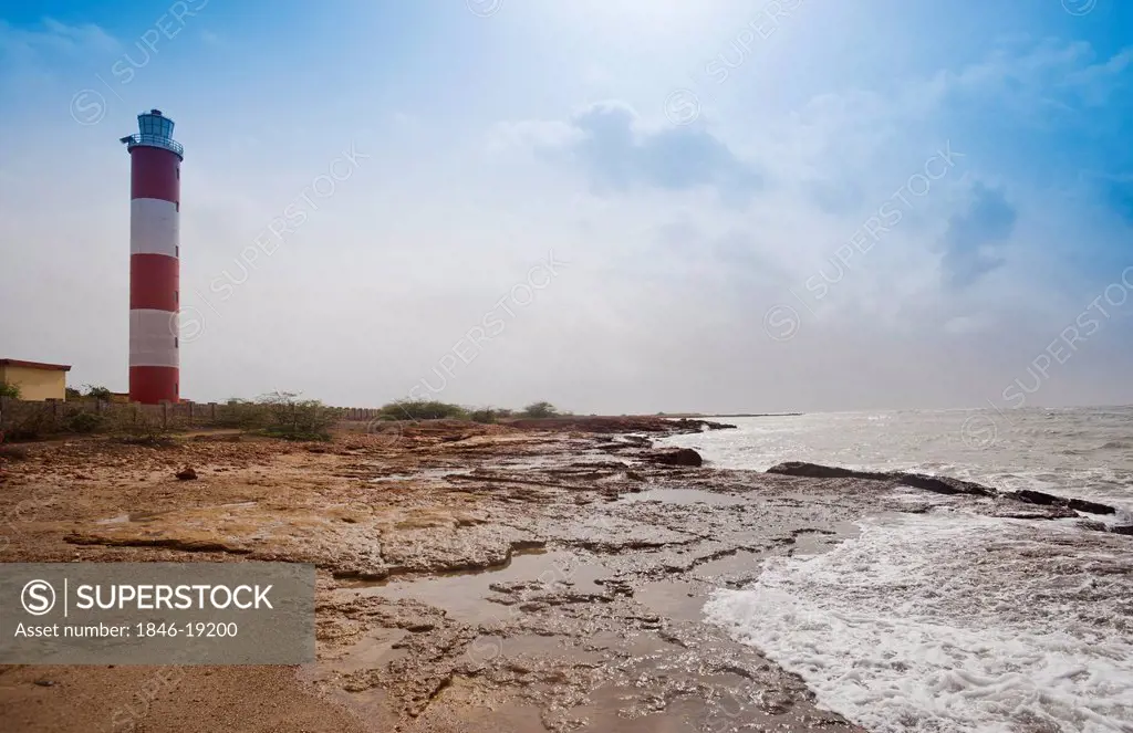 Lighthouse at the coast, Dwarka Beach, Dwarka, Gujarat, India