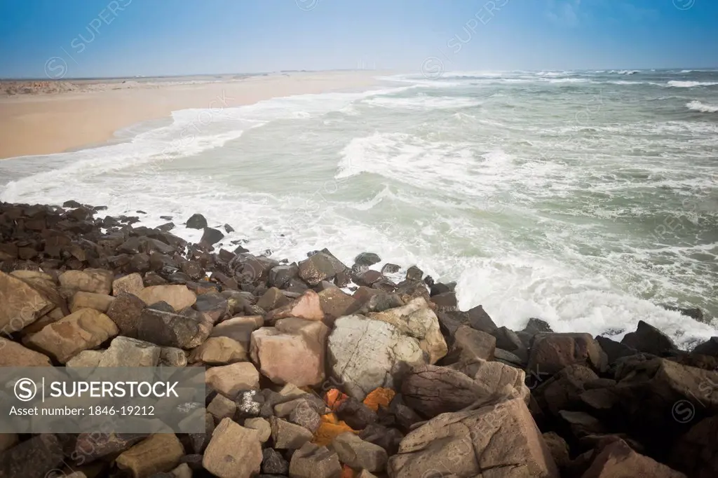 Rocks with tide on the beach, Dwarka Beach, Dwarka, Gujarat, India