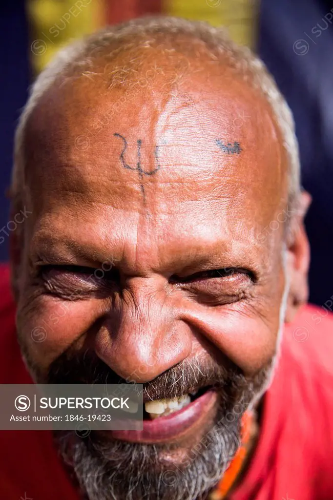 Portrait of a sadhu smiling in Kumbha Mela, Allahabad, Uttar Pradesh, India