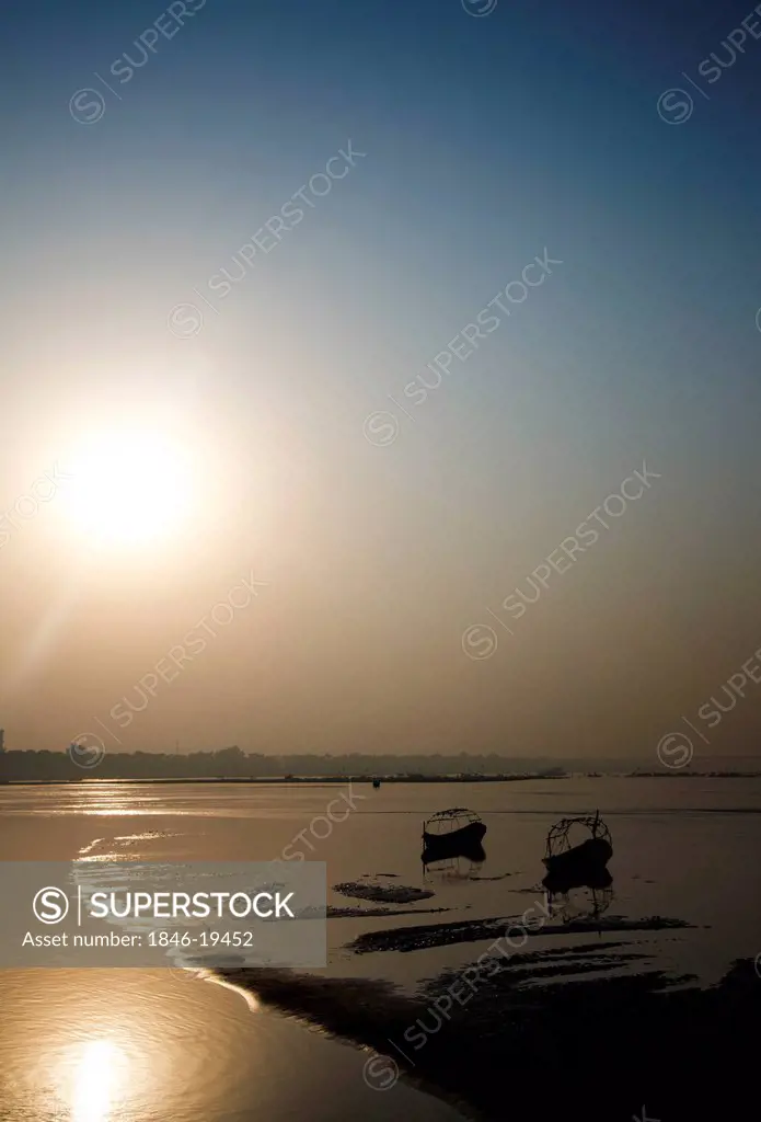 Boats in the Ganges River during Kumbh Mela Festival at sunset, Allahabad, Uttar Pradesh, India
