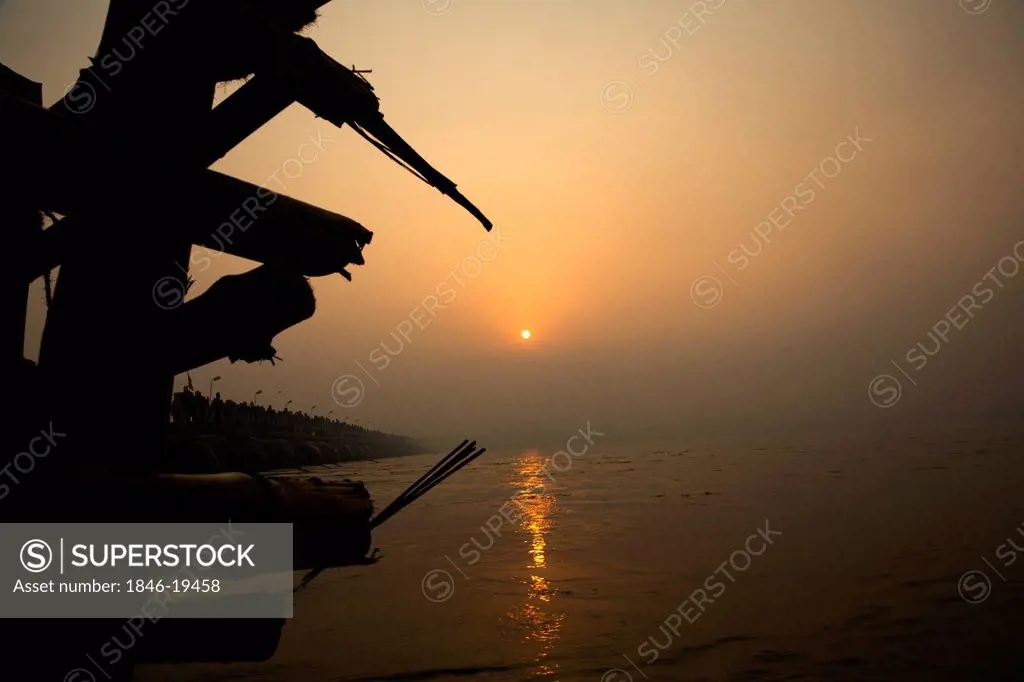 Sunset over Sangam river during the first royal bath procession in Kumbh Mela festival, Allahabad, Uttar Pradesh, India