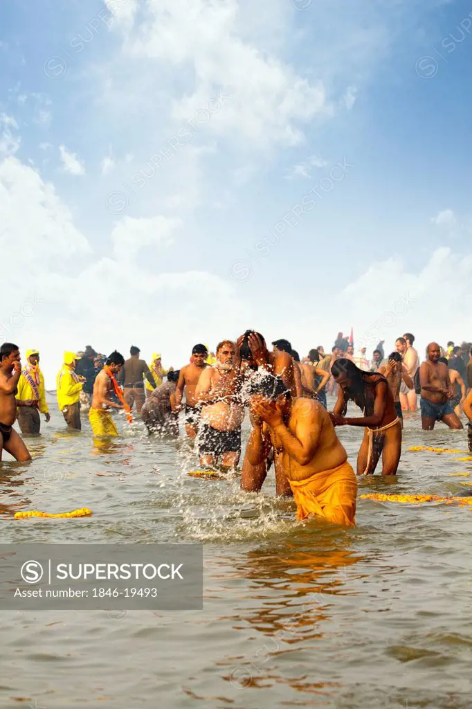 Pilgrims bathing in the Sangam river during the first royal bath procession in Kumbh Mela festival, Allahabad, Uttar Pradesh, India