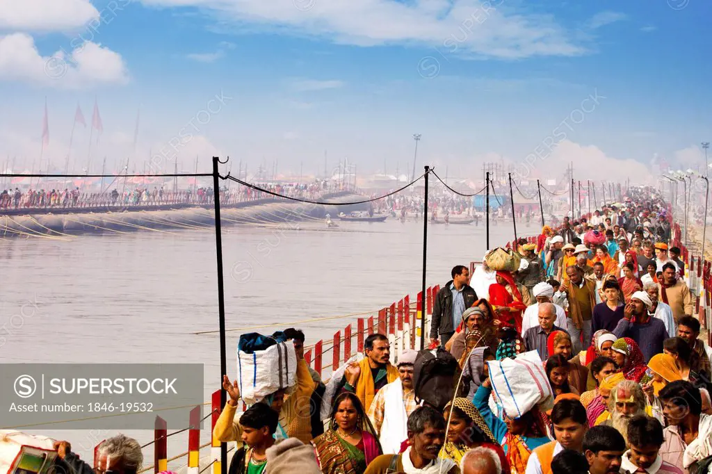 Pilgrims crossing the bridge during the first royal bath procession in Kumbh Mela festival, Allahabad, Uttar Pradesh, India