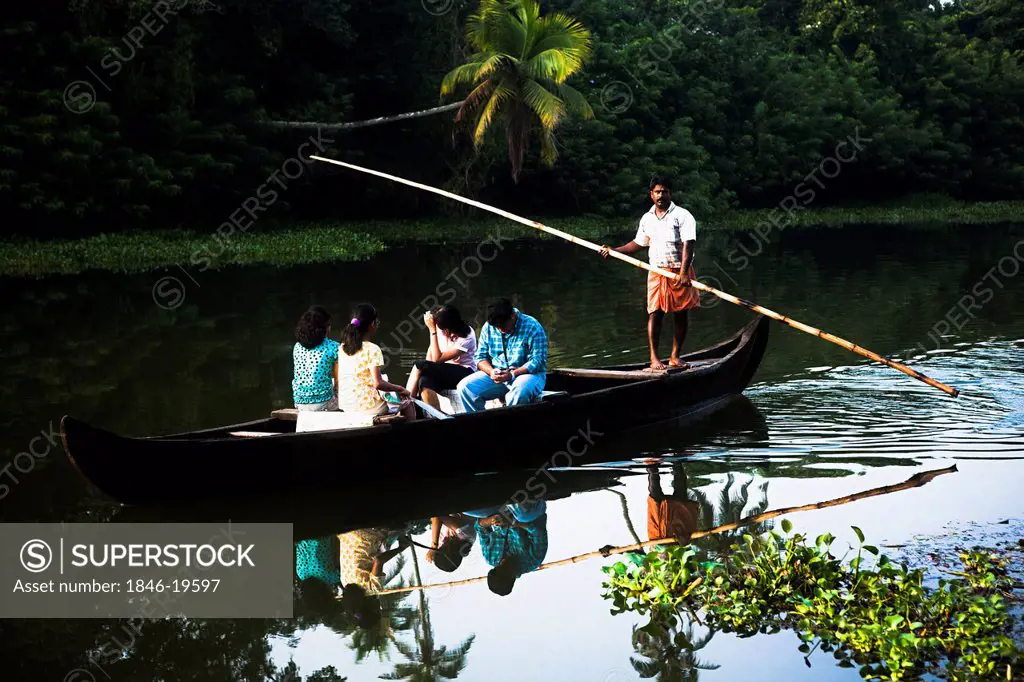 Tourists in a canoe, Kerala Backwaters, Alappuzha District, Kerala, India