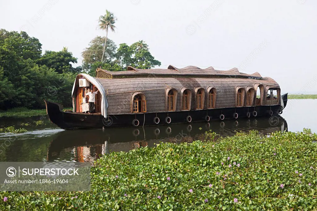 Houseboat in a lagoon, Kerala Backwaters, Alappuzha District, Kerala, India