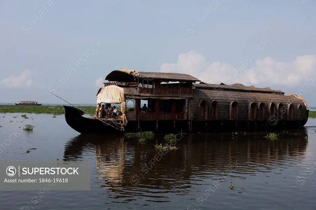 Houseboat in a lagoon, Kerala Backwaters, Alappuzha District, Kerala, India