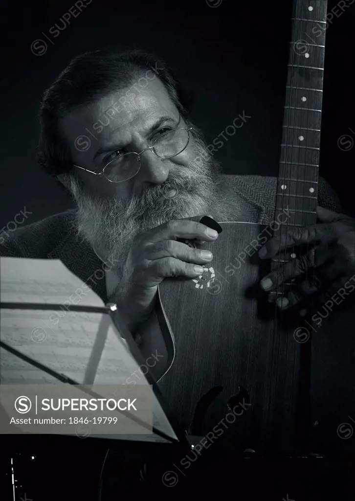Guitarist tuning his guitar