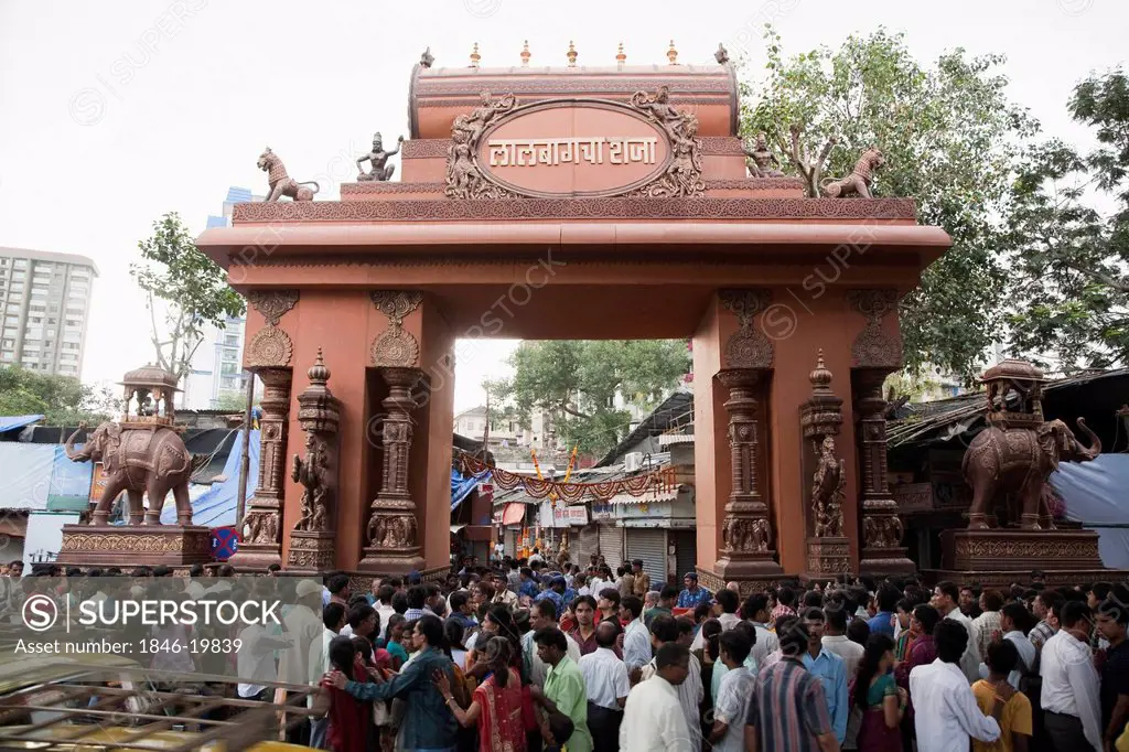 Crowd at the entrance of a temple during religious procession of Ganpati visarjan ceremony, Mumbai, Maharashtra, India