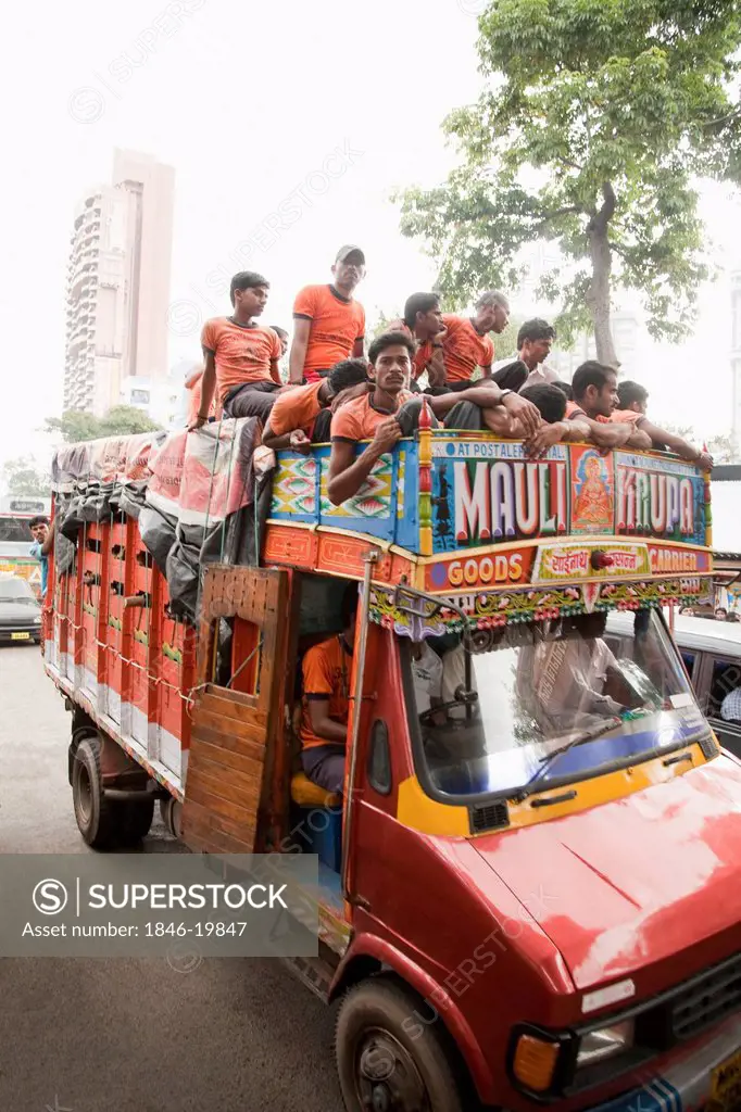 People on a truck during a religious procession, Mumbai, Maharashtra, India