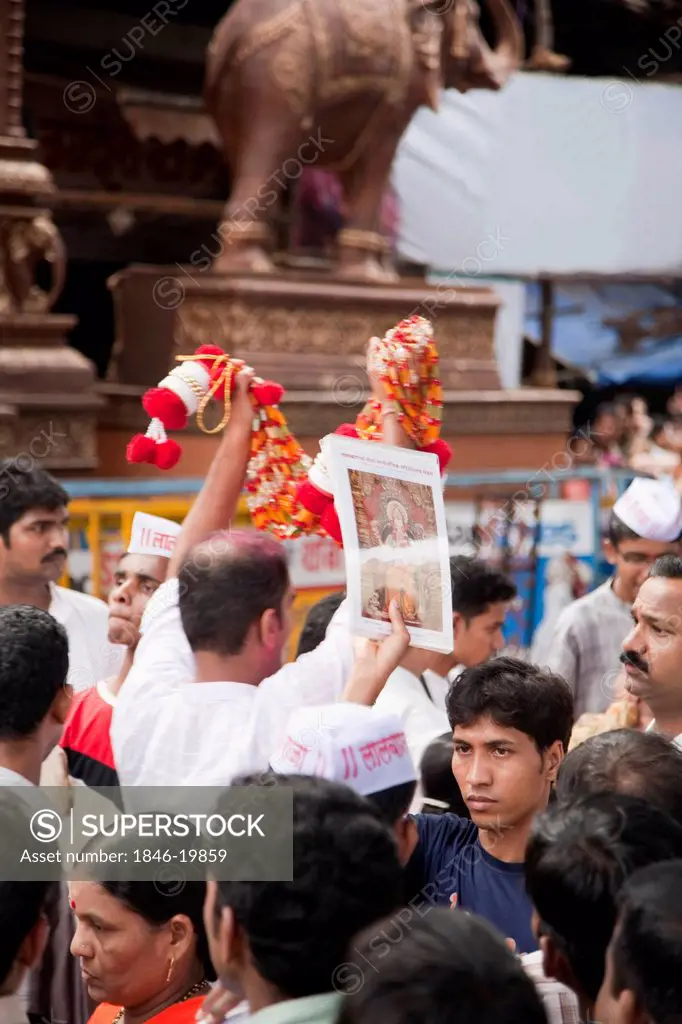 Hawkers selling posters and garlands at a temple, Mumbai, Maharashtra, India