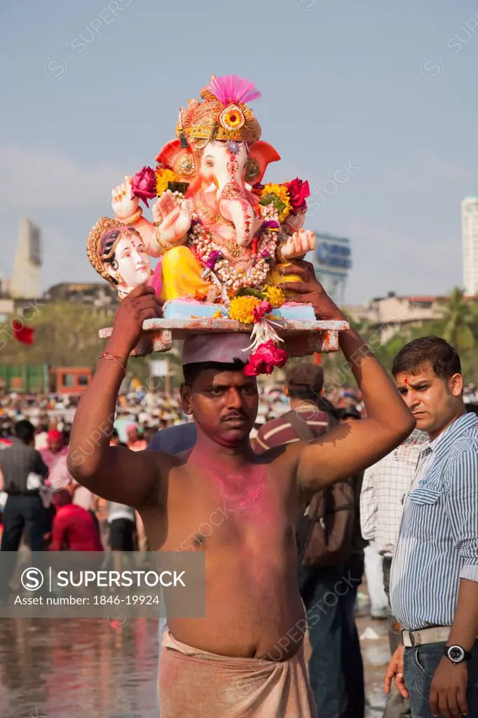 People at the immersion ceremony of Lord Ganesha, Mumbai, Maharashtra, India