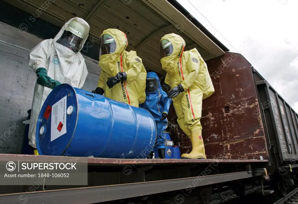 Firemen wearing hazmat suits at work during a disaster control drill, near Poing, Bavaria, Germany, Europe
