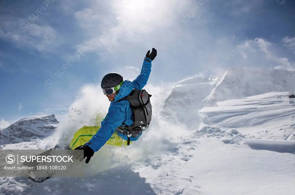 Snowboarder, dynamic snow, action, St. Moritz, Switzerland, Europe