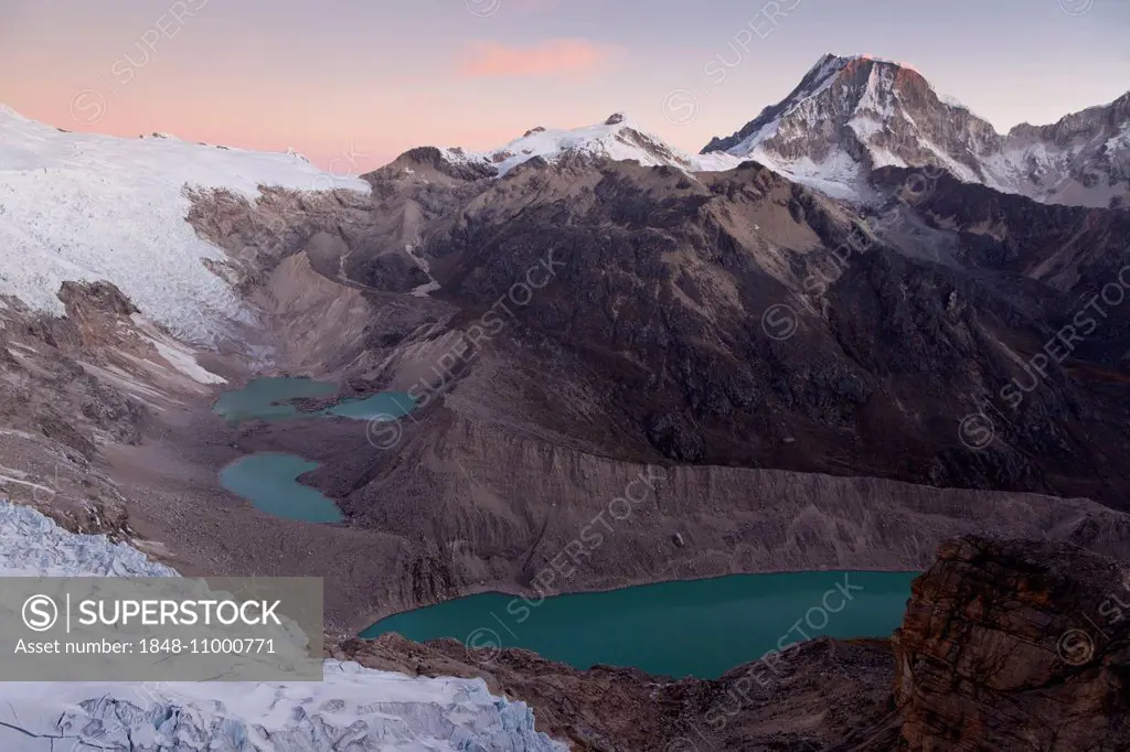 Glacial lakes at Mt Nevado Tocllaraju, peaks of the Cordillera Blanca, at dusk, Peru