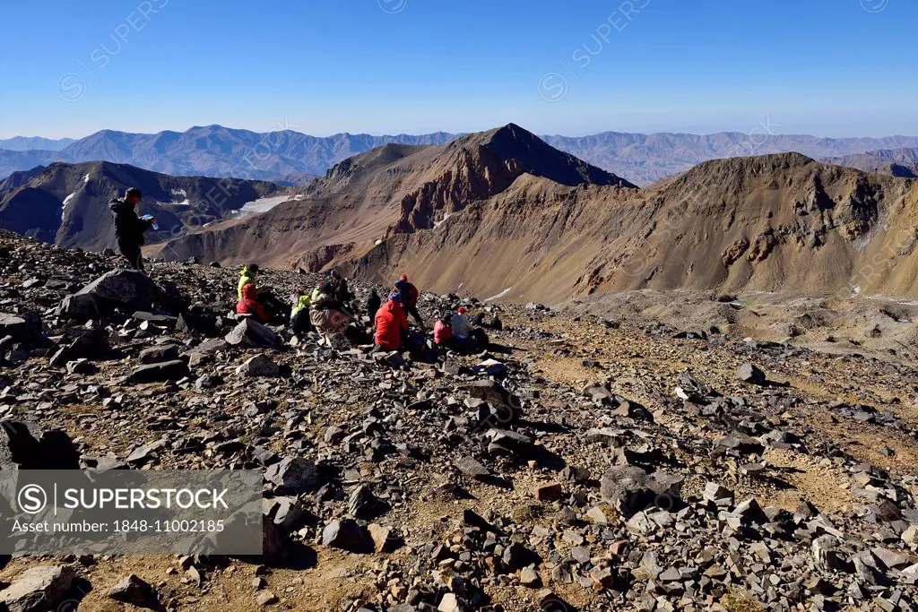 Group of hikers resting on the way to Alam Kuh, 4848m, Kelardasht, Takht-e Suleyman Massif, Alborz Mountains, Mazandaran Province, Persia, Iran