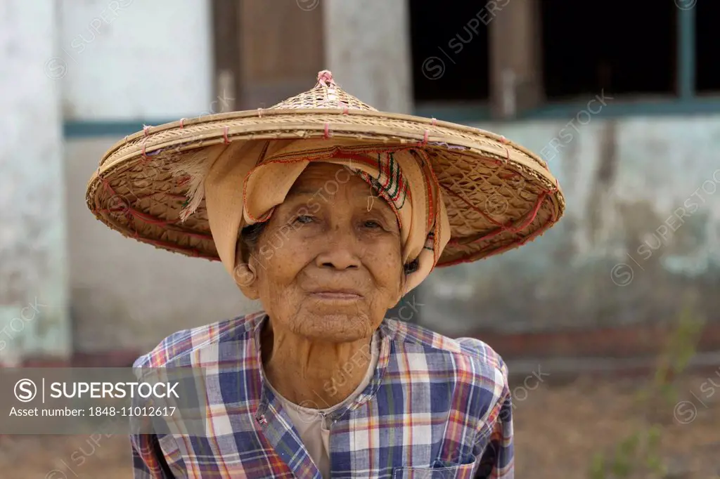 Old female farmer wearing a hat, Yangon, Myanmar