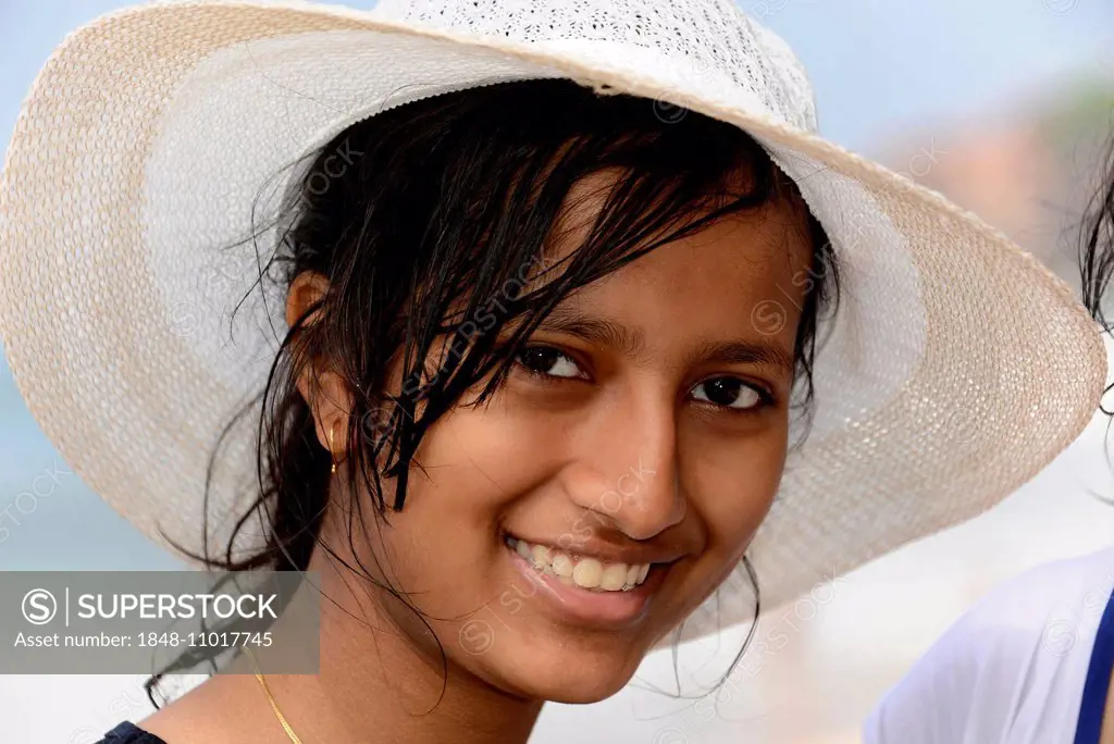 Portrait of young Indian woman wearing a hat, Kerala, South India, India