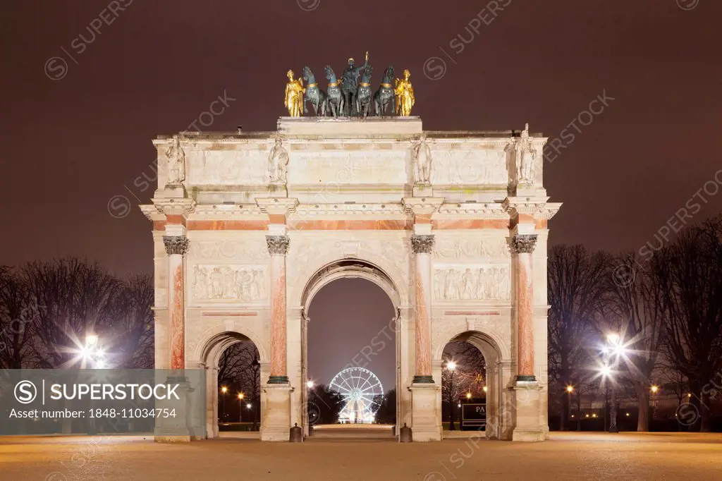 Arc de Triomphe du Carrousel, in front of a ferris wheel on Place de la Concorde, Paris, Île-de-France region, France