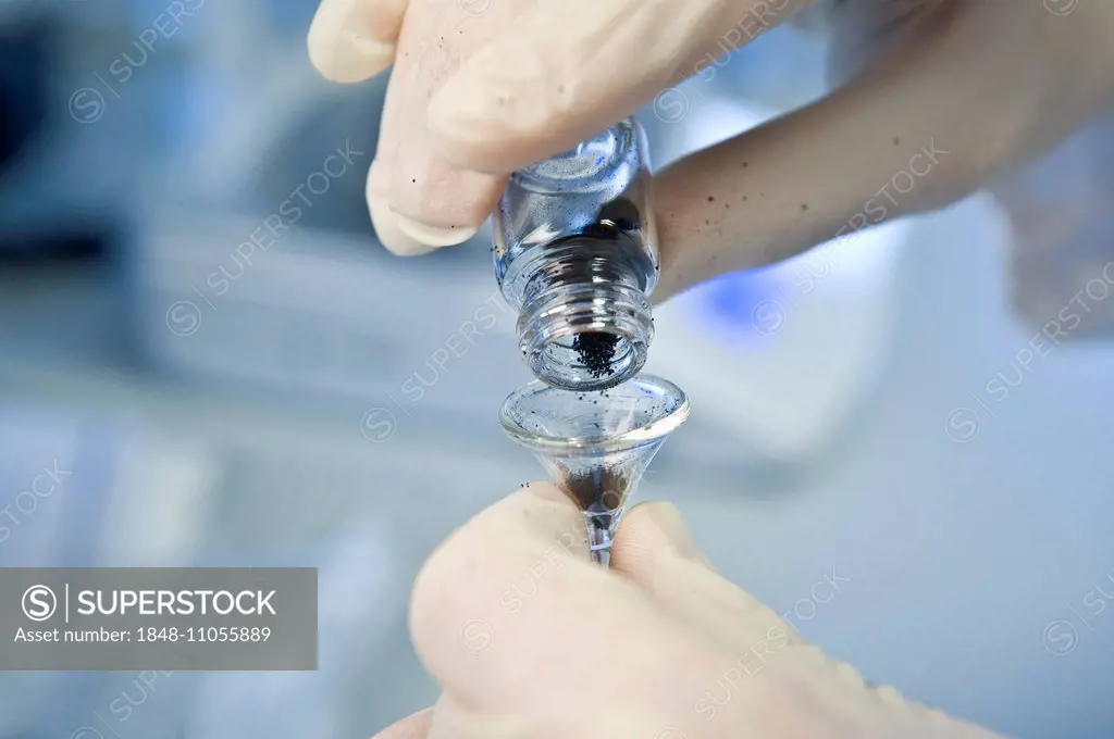 Small funnel being filled, in a laboratory, Germany