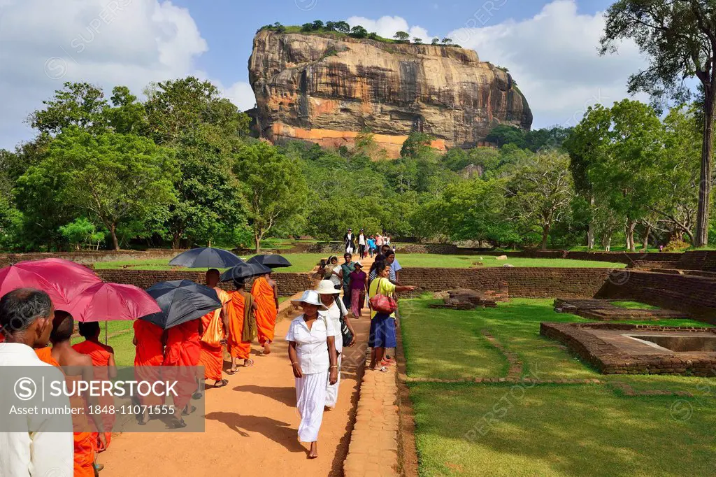Buddhist monks on their way to the Lion Rock, Sigiriya, UNESCO World Heritage Site, Sigiriya, Central Province, Sri Lanka