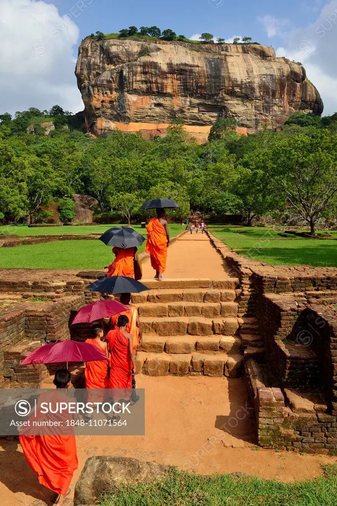 Buddhist monks on their way to the Lion Rock, Sigiriya, UNESCO World Heritage Site, Sigiriya, Central Province, Sri Lanka