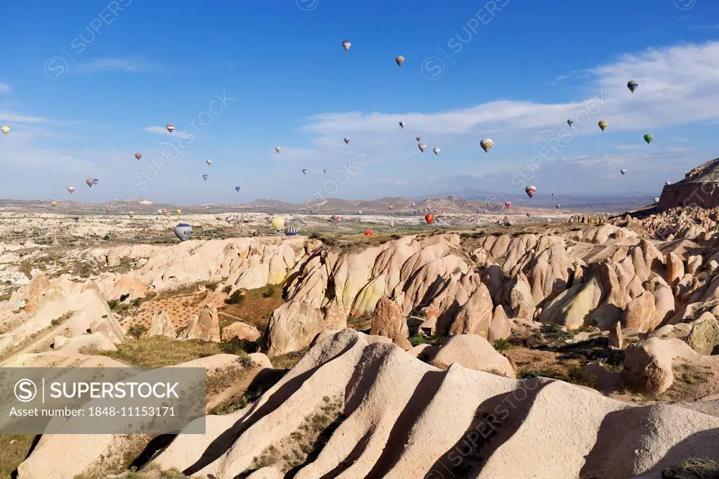 Hot air balloons, tufa formations at Sunset View Point, Göreme National Park, Cappadocia, Central Anatolia Region, Anatolia, Turkey