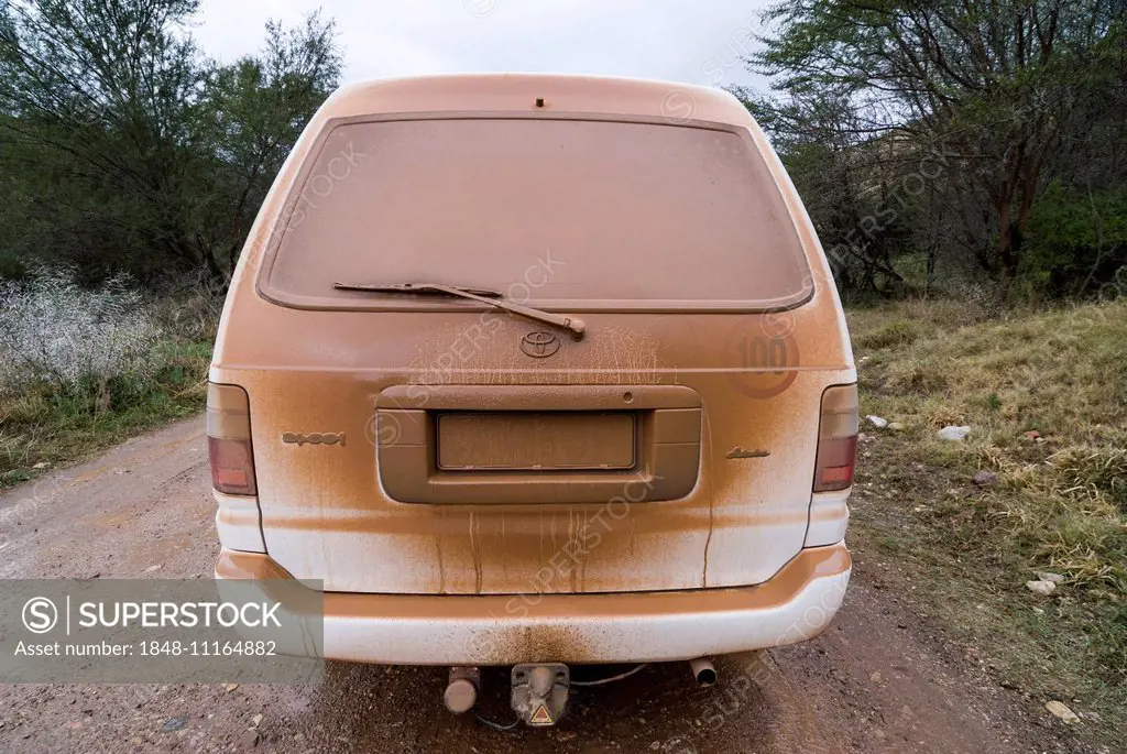 Dusty car on on a gravel road, Baviaanskloof Nature Reserve, Eastern Cape, South Africa