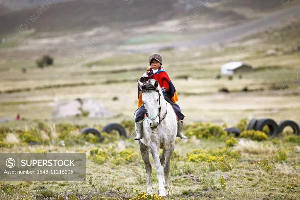 Boy from the Puruhá people riding on a horse, Kichwa, Chimborazo Province, Ecuador