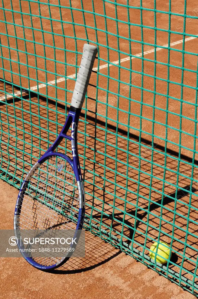Tennis racket next to net