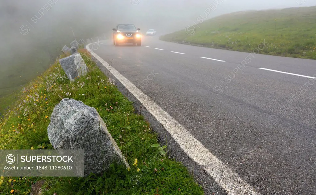 Vehicles in the fog on the Großglockner High Alpine Road, High Tauern National Park, Austria