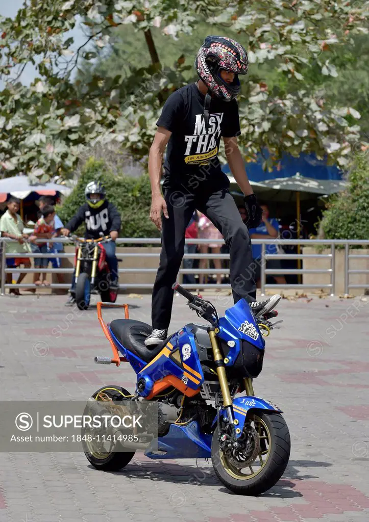 Motorcycle stunt rider performing, Cha Am, Thailand