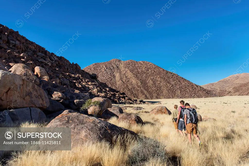 Three hikers at the Naukluft Mountains, Namib-Naukluft, Namibia