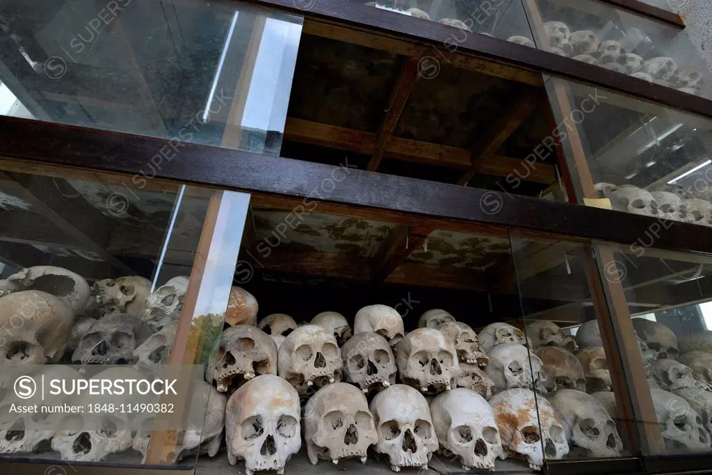 Skulls and bones in the Memorial Stupa to the prisoners murdered by the Communist or Maoist Khmer Rouge in Choeung Ek, Killing Fields, Phnom Penh, Cam...